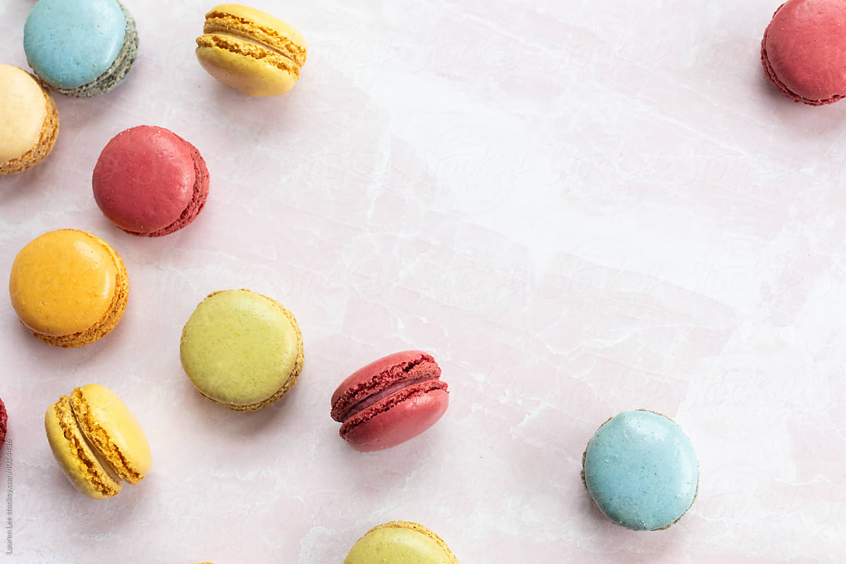 Happy colorful macaroons on pink marble