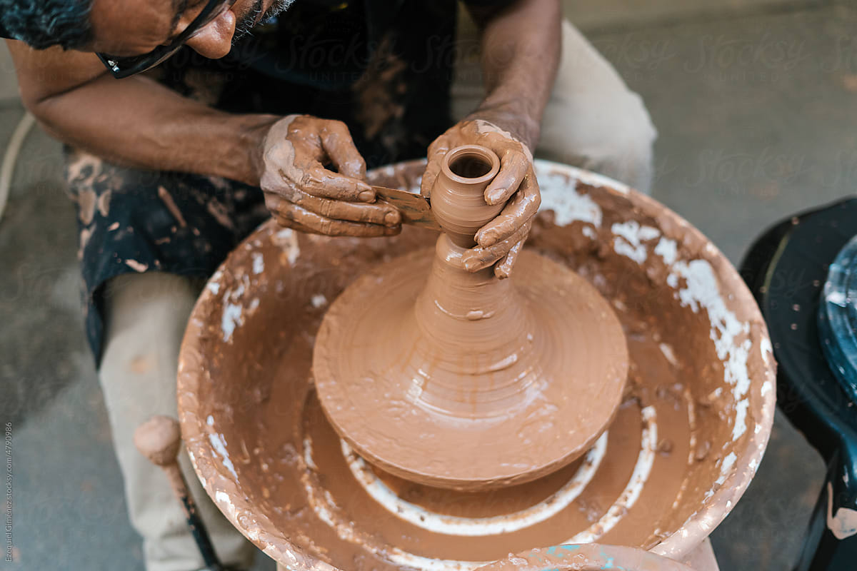 Anonymous potter creating clay vessel
