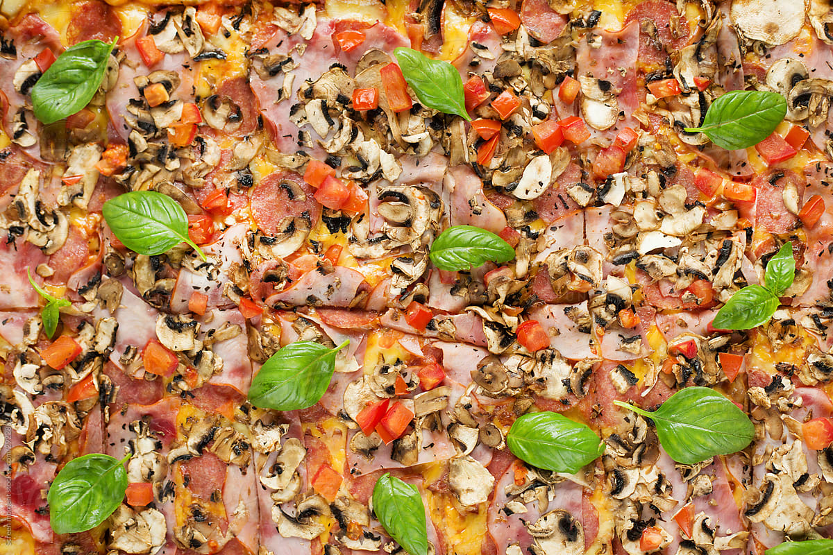 square pizza with basil tomatoes and mushrooms in the package