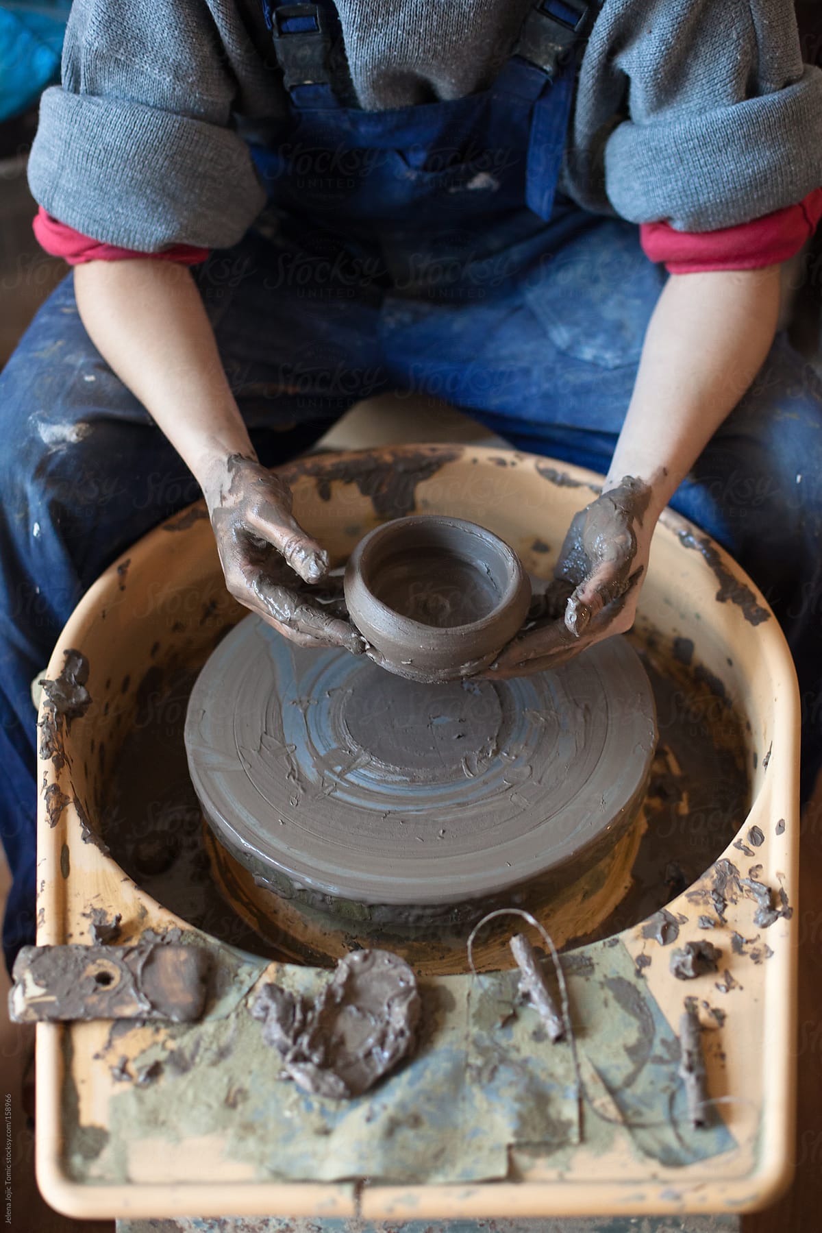 Shaping A Clay On Electric Pottery Wheel by Stocksy Contributor Jelena  Jojic Tomic - Stocksy