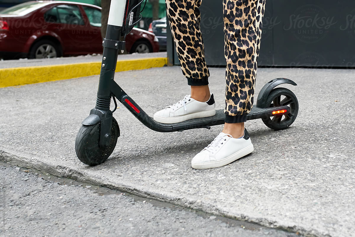 Concept photo of woman using electric scooter
