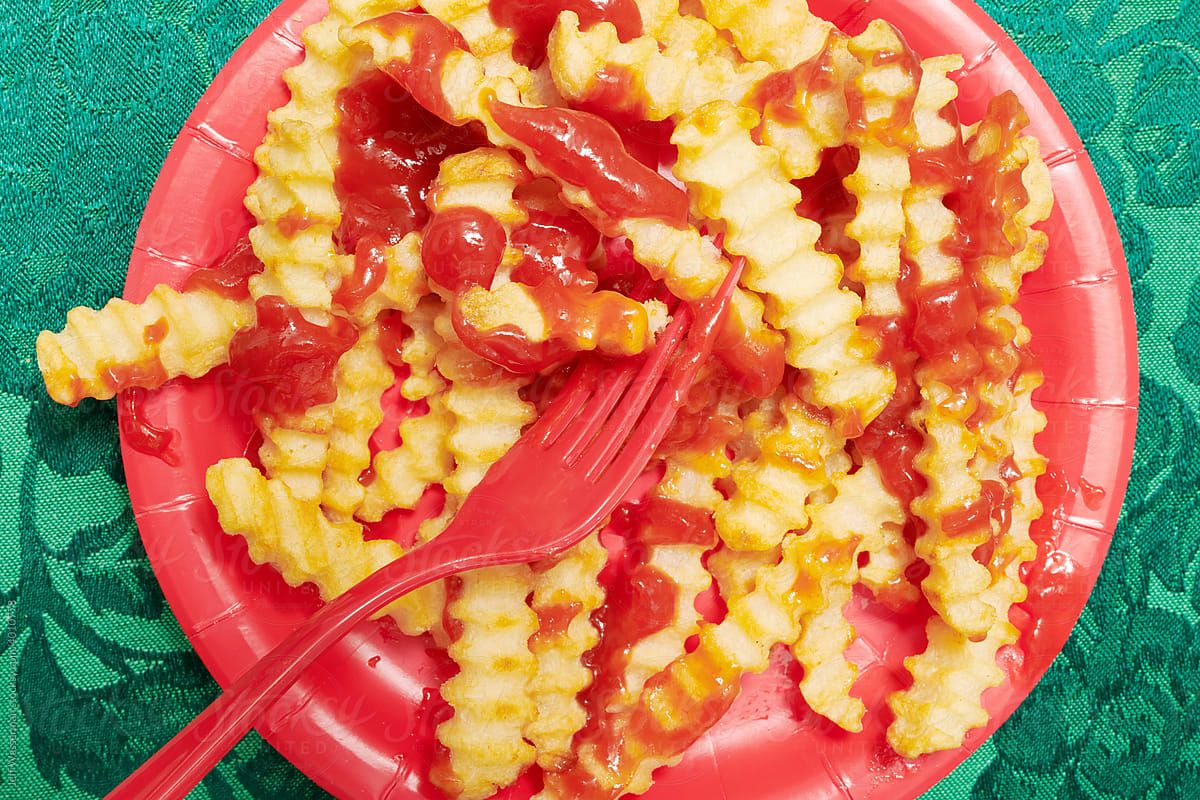 Closeup of French Fries with Ketchup and Ketchup From Above