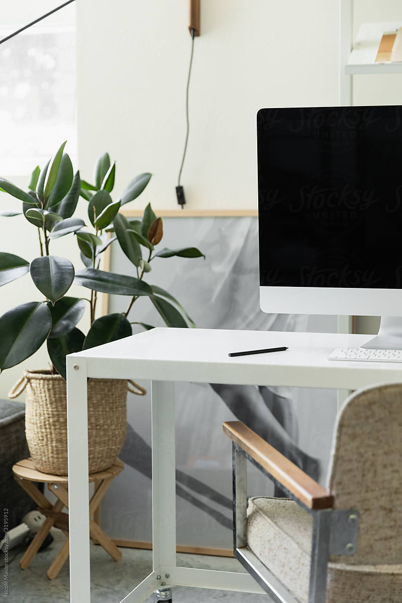 minimal home office with imac in bright organized studio