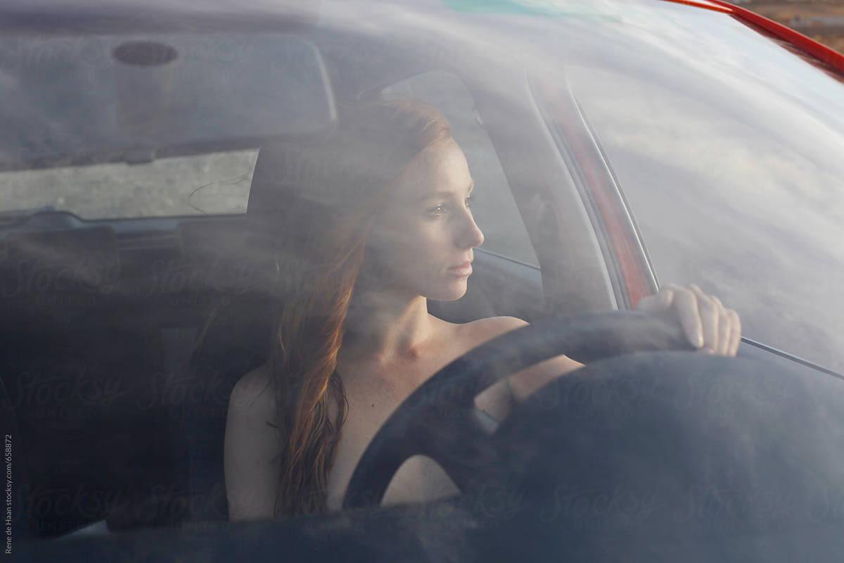 young woman driving a car