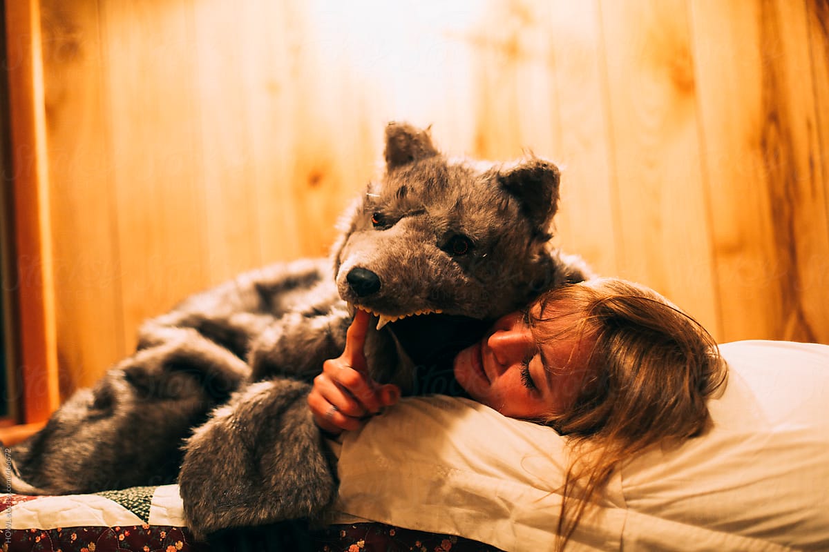 a drunk young woman in a wolf costume