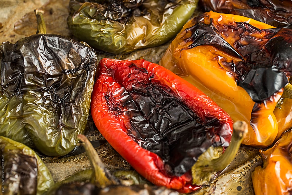 closeup of red, green, and yellow roasted bell peppers