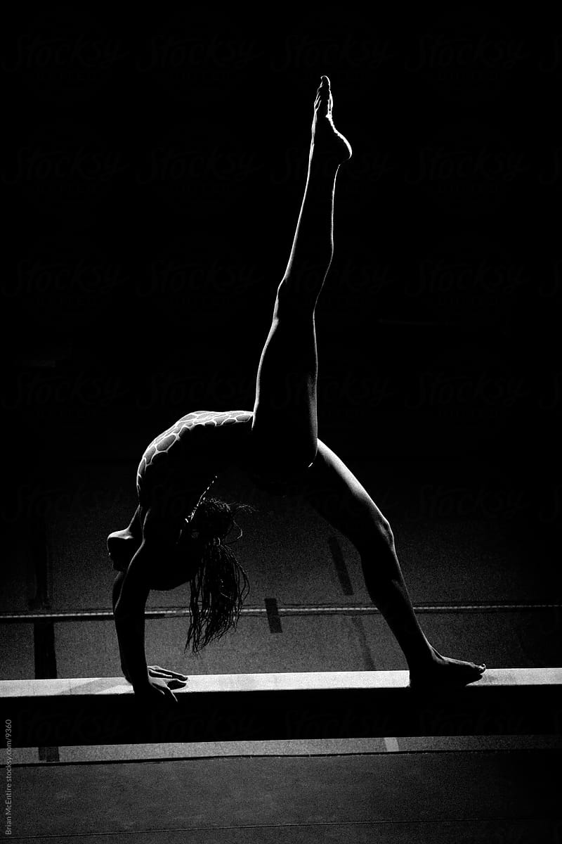 Silhouetted Black Gymnast in Back Walkover
