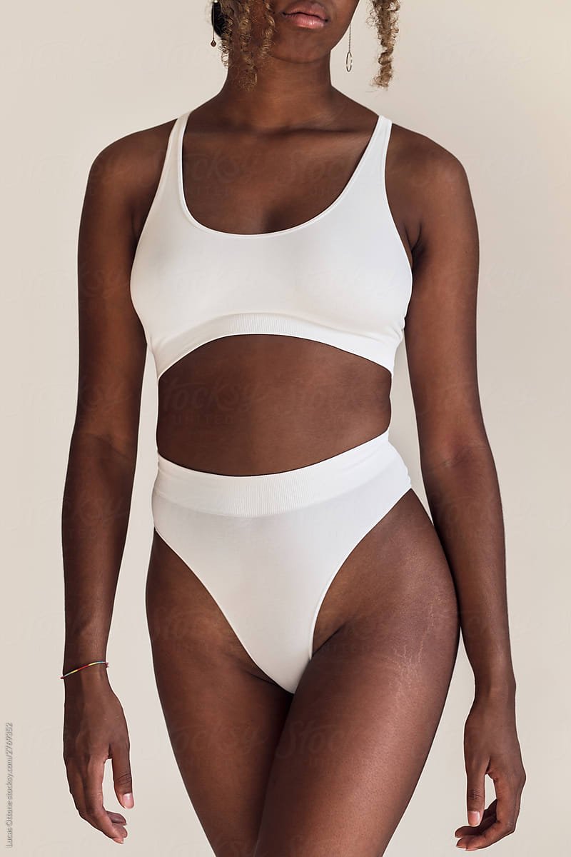 Black Woman In White Underwear by Stocksy Contributor Lucas