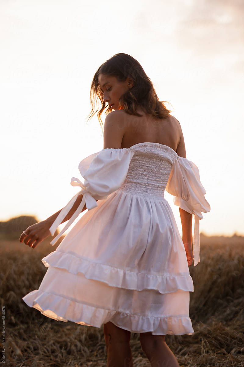 Girl in airy garment during evening in nature