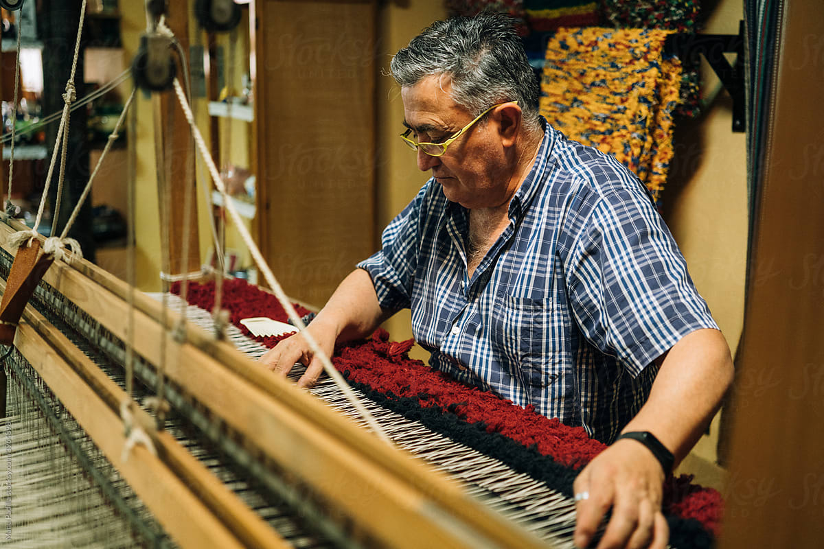 A Craftsman Works in an Artisanal Loom