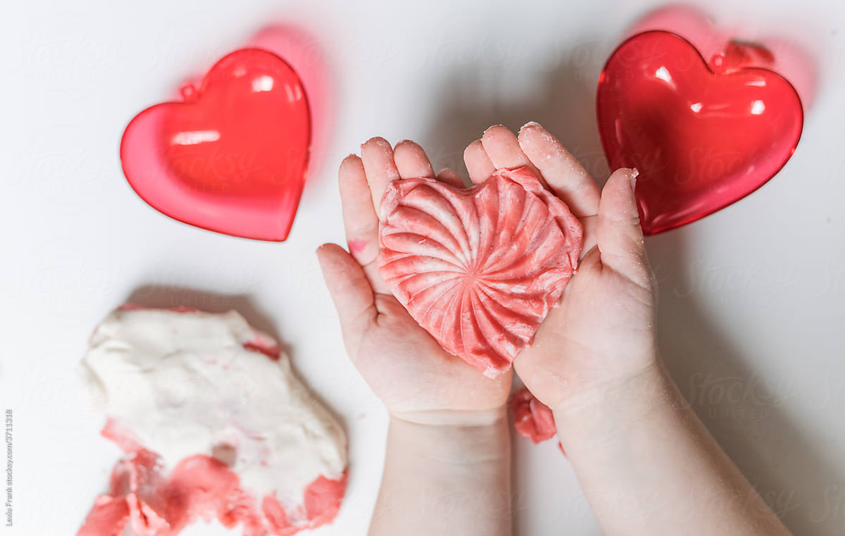 valentines day kids crafts- hand holding play dough heart
