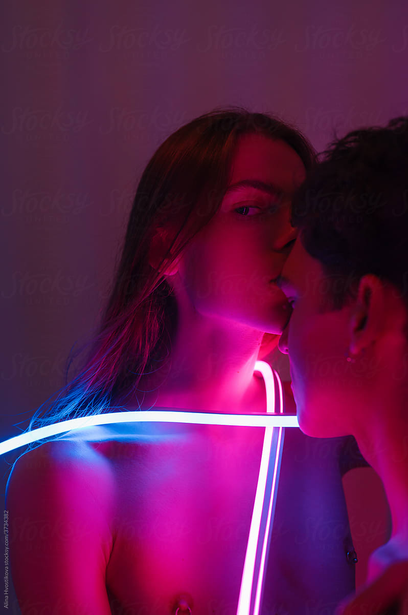 Gay couple with neon light