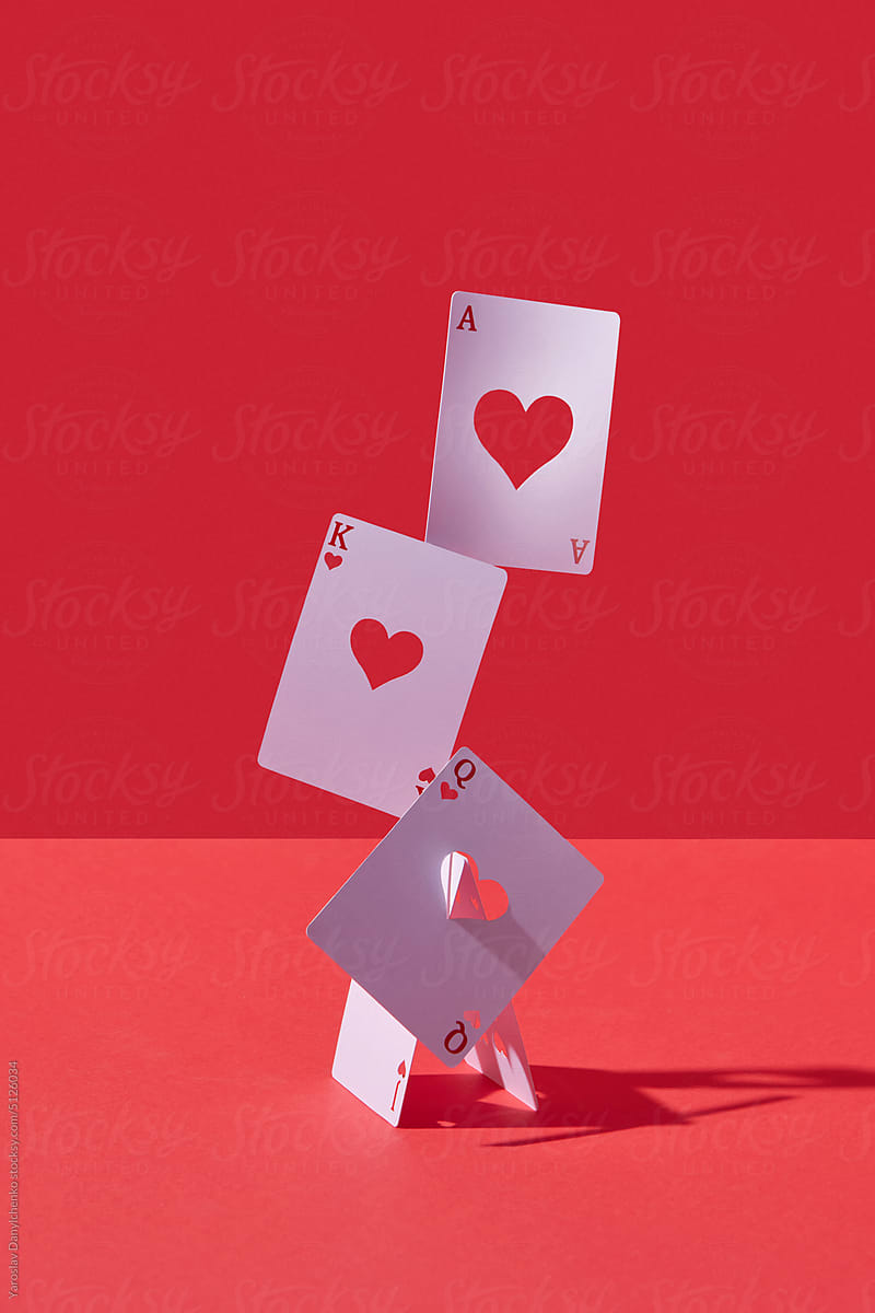 Ace, king and queen cards with cut heart hollows.