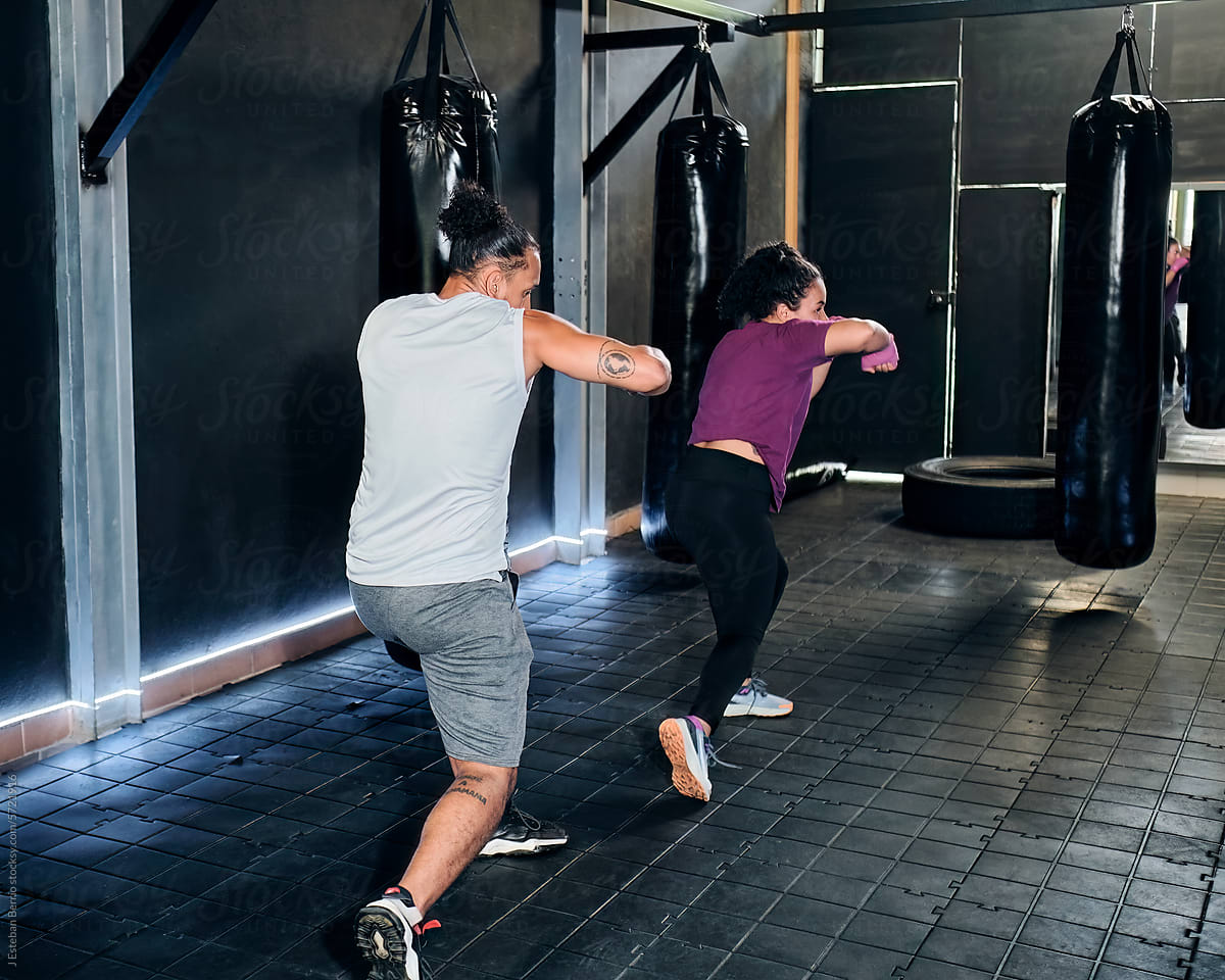 Couple boxing training at the gym