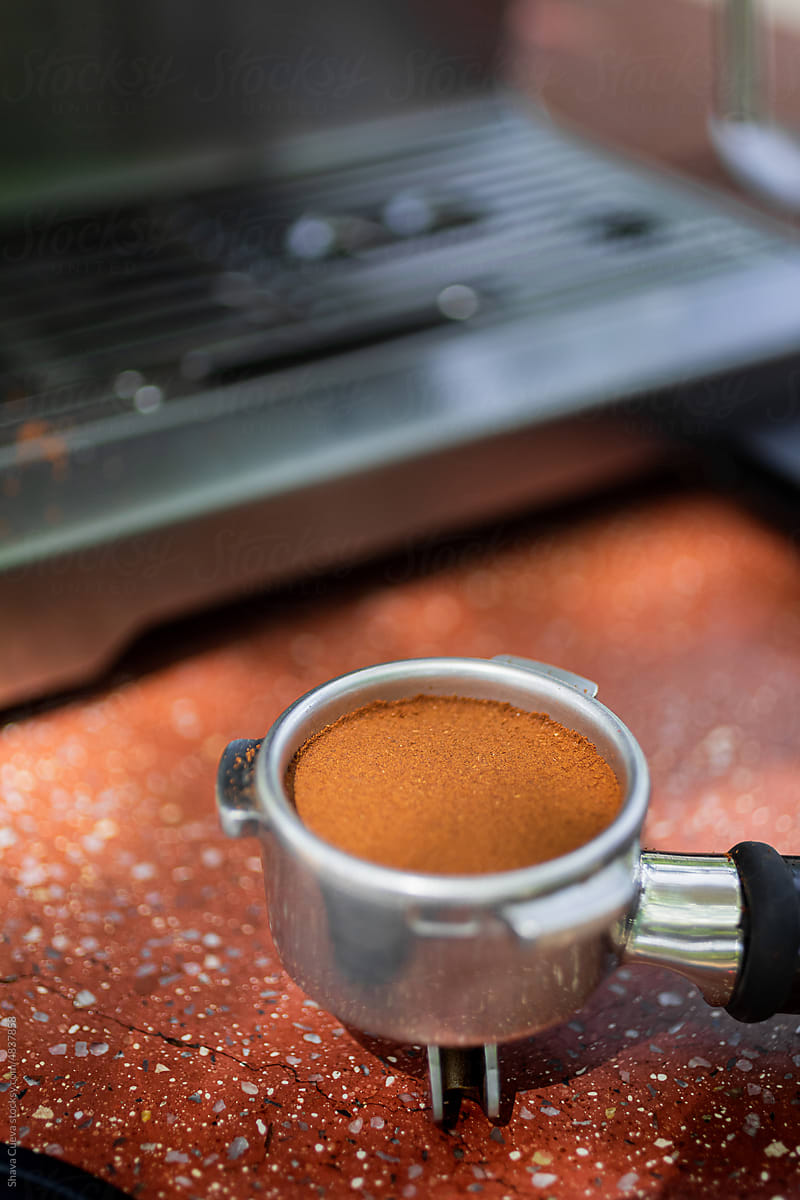Closeup of tempered coffee in portafilter
