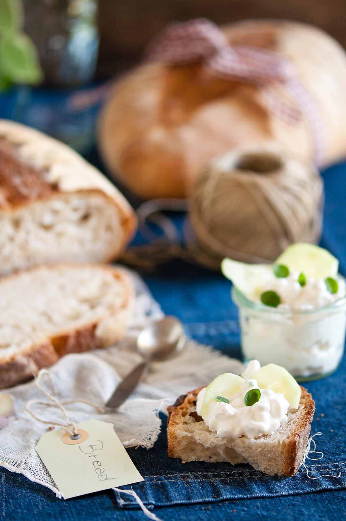 slice of bread with cottage cheese, cucumber and oregano