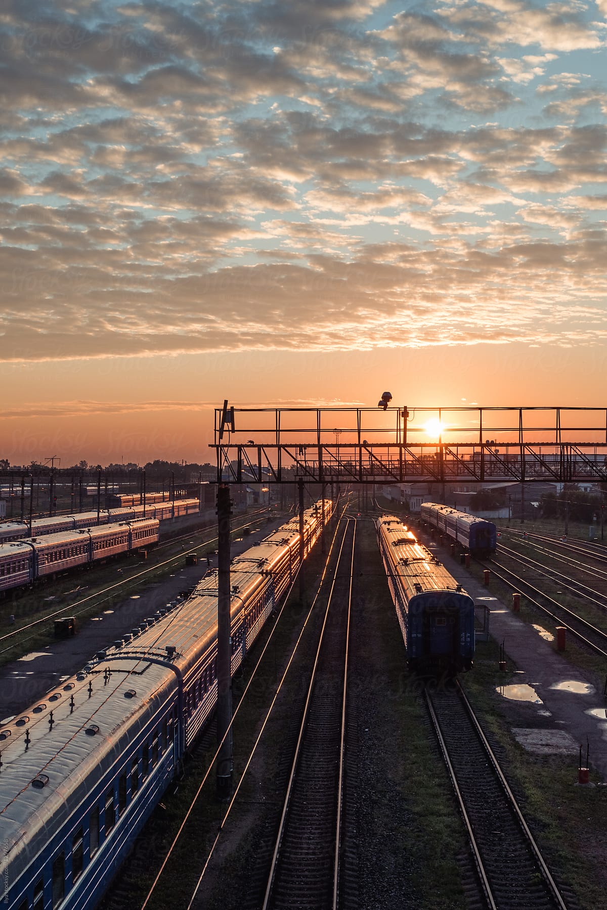 Railway station with trains on sunrise
