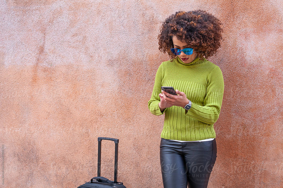 african american woman tourist using smartphone