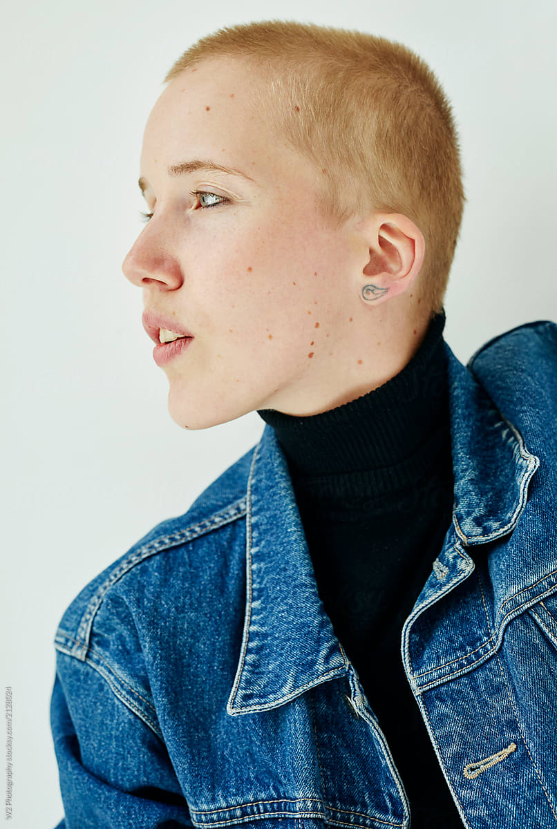 Profile portrait of a woman with short hair.