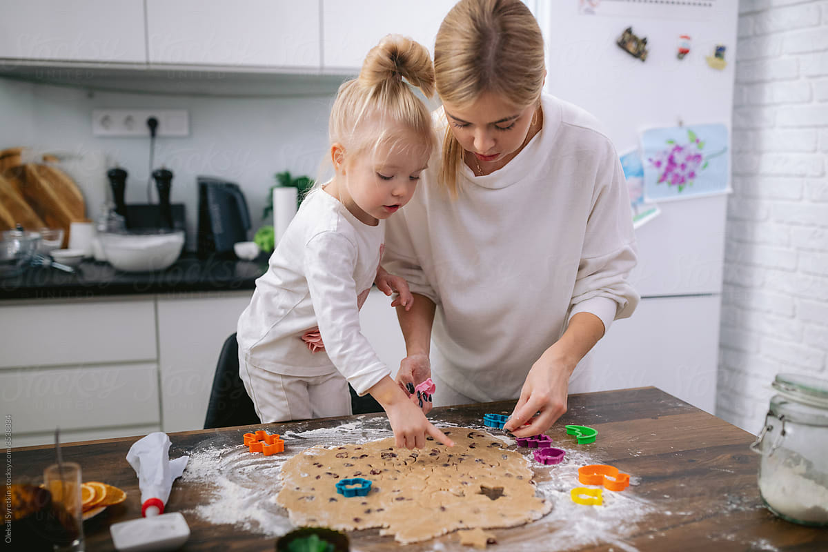 Mother with daughter making sweets