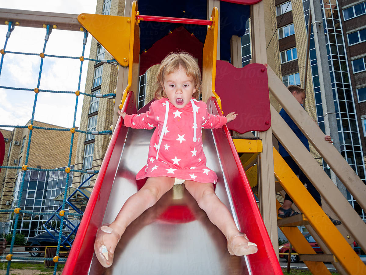 cute child on playground slide