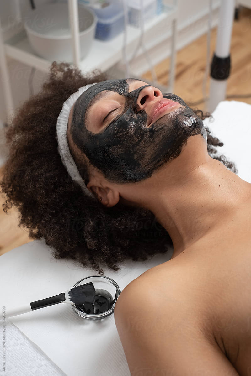 Woman With Black Carbon Face Mask