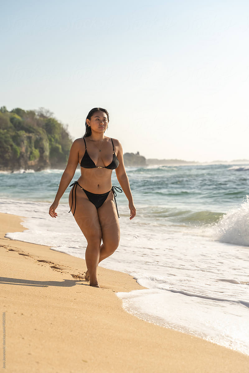 Plus Size Woman Walking at the beach