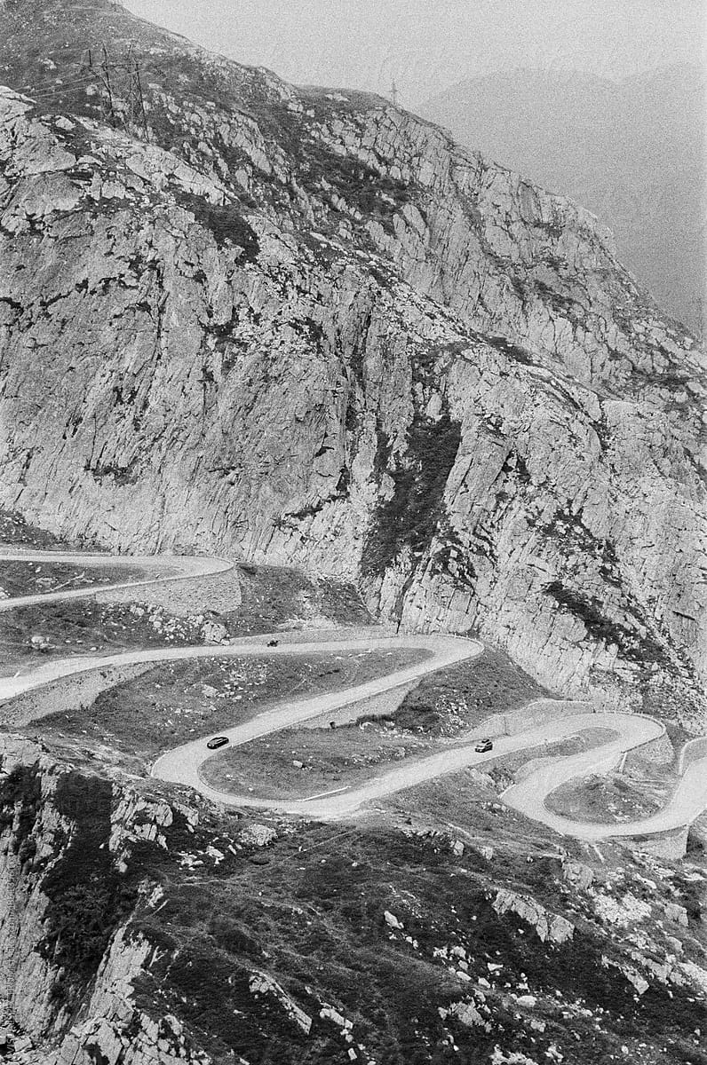 Cars Driving Old Mountain Pass Road With Many Turns