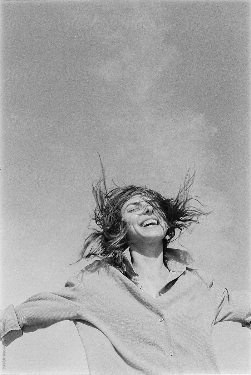 Smiling woman with wind in her hair