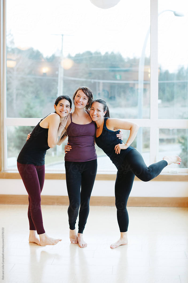 Friendly people hanging out in yoga studio class.