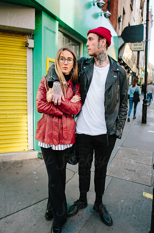 Punk man with arm around cool vintage styled woman