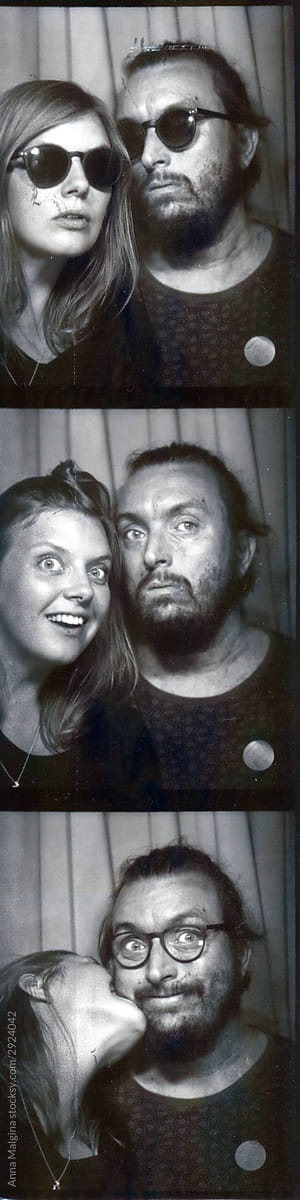 A portrait of a loving couple in a photobooth