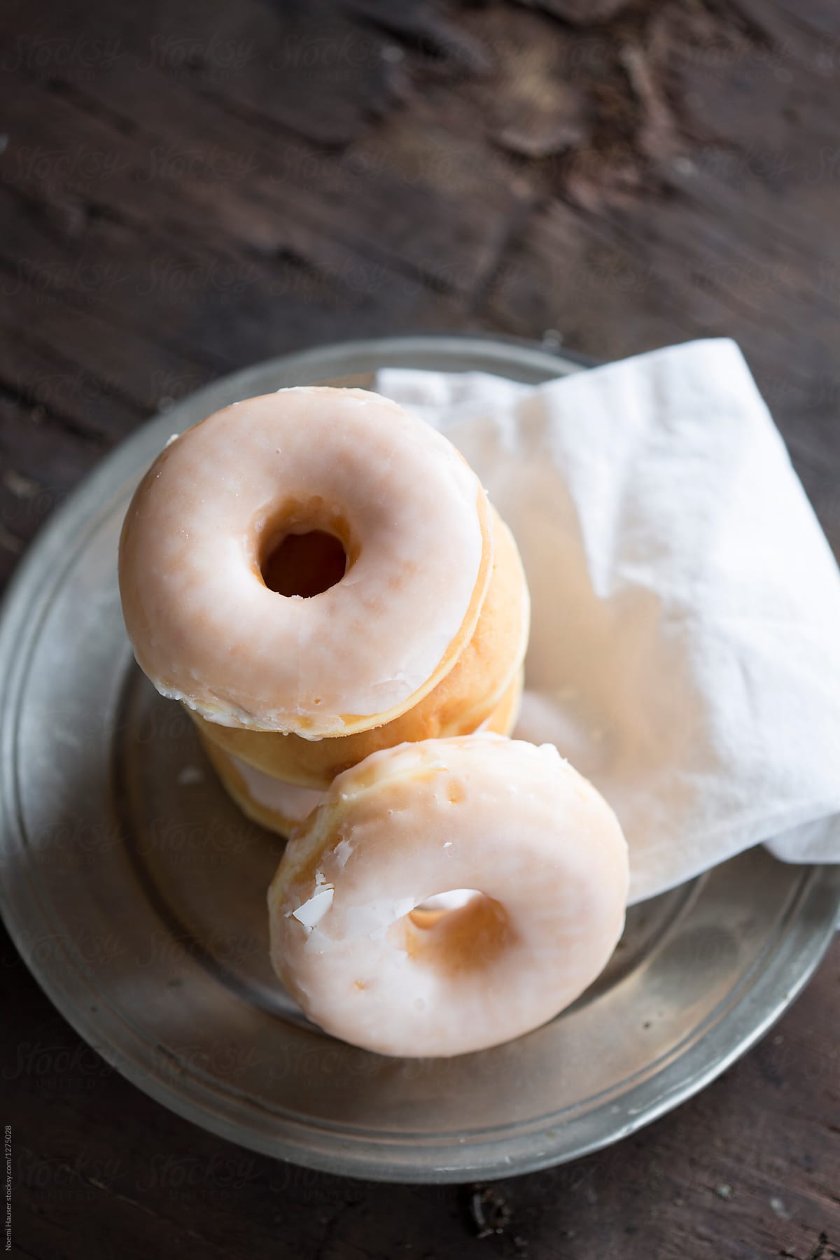 Sugar glazed donuts on vintage plate