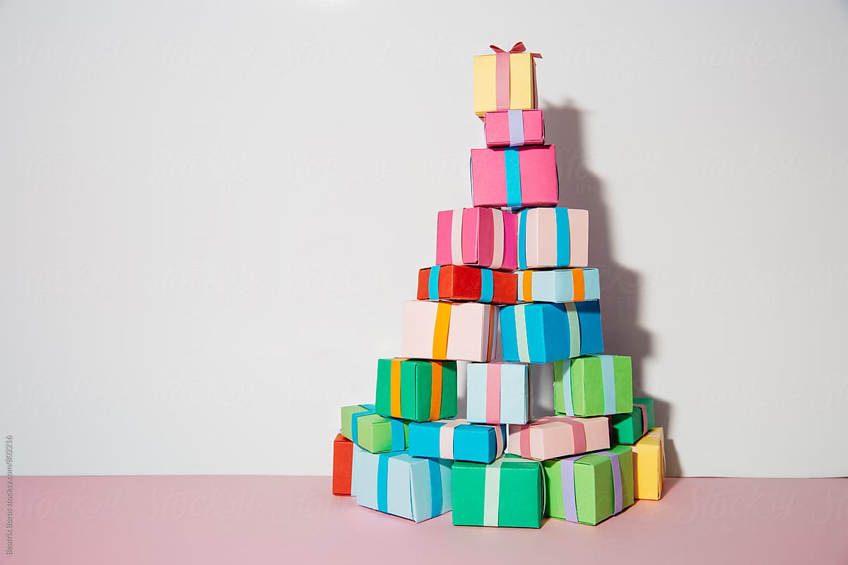 Colorful gift boxes arranged in a shape of a Christmas tree with huge copyspace