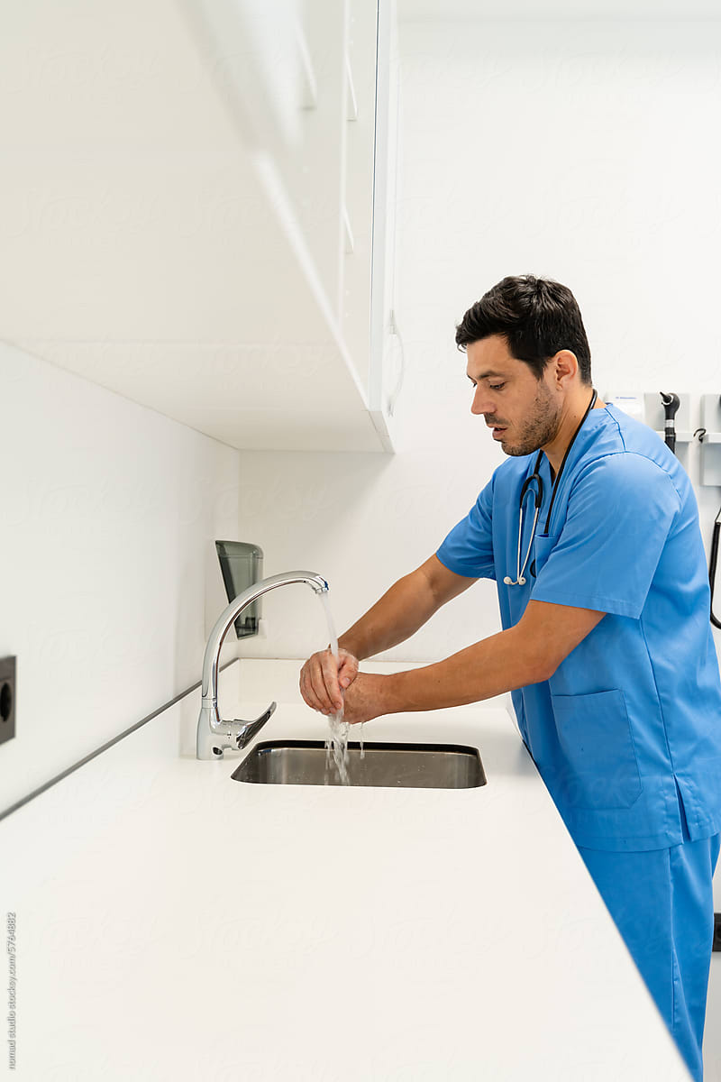 male doctor washing hands in the operation room