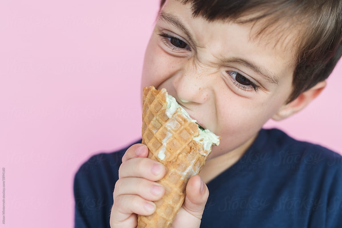 A Boy With Dripping Ice Cream Cone