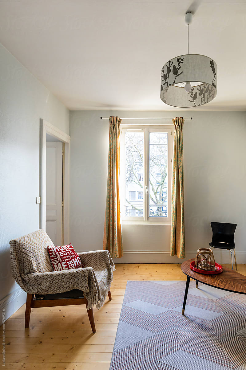 Classic small french apartment with big window, comfortable armchair