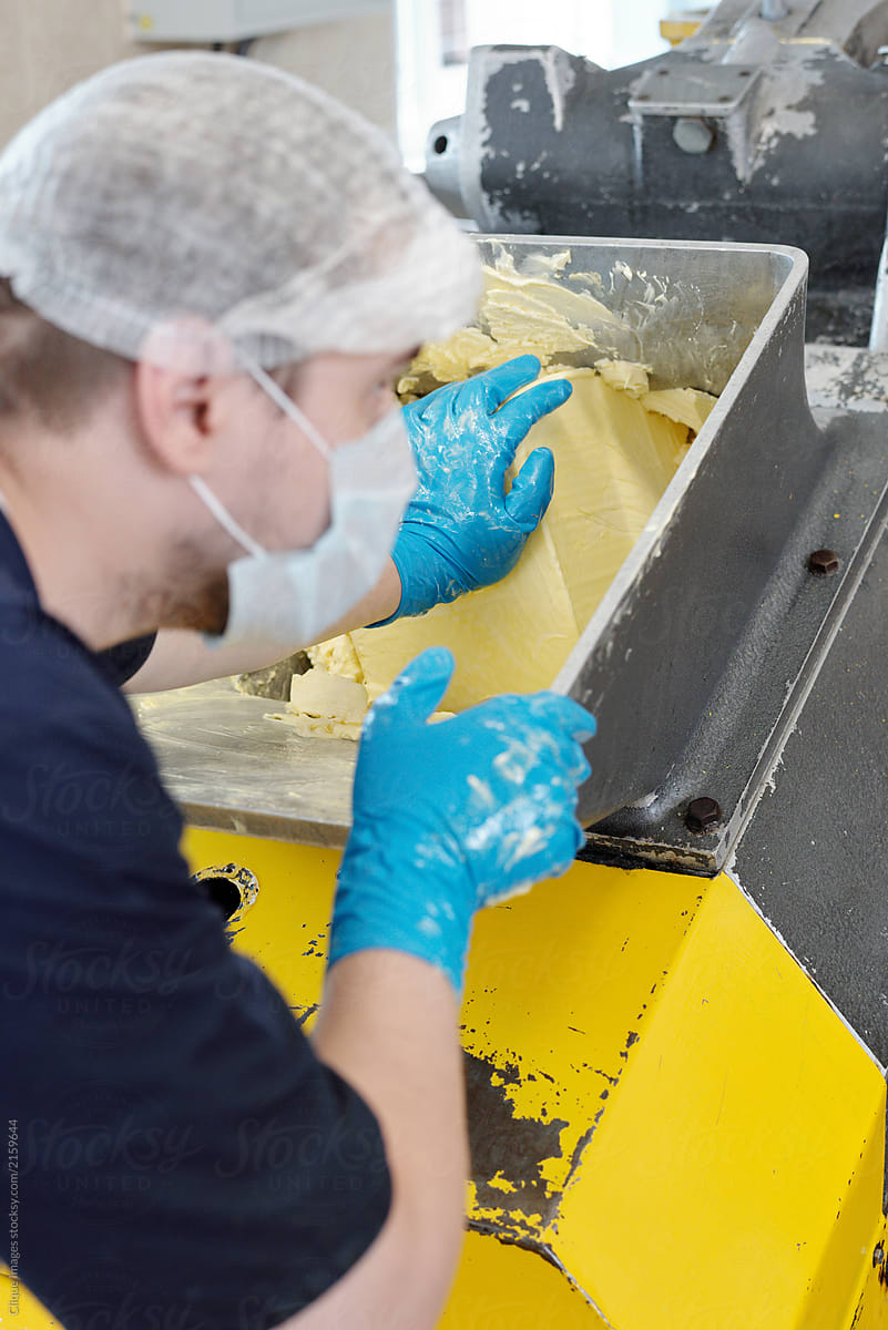 Factory Worker Making Butter
