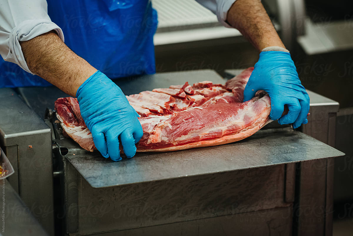 Butcher in a meat factory