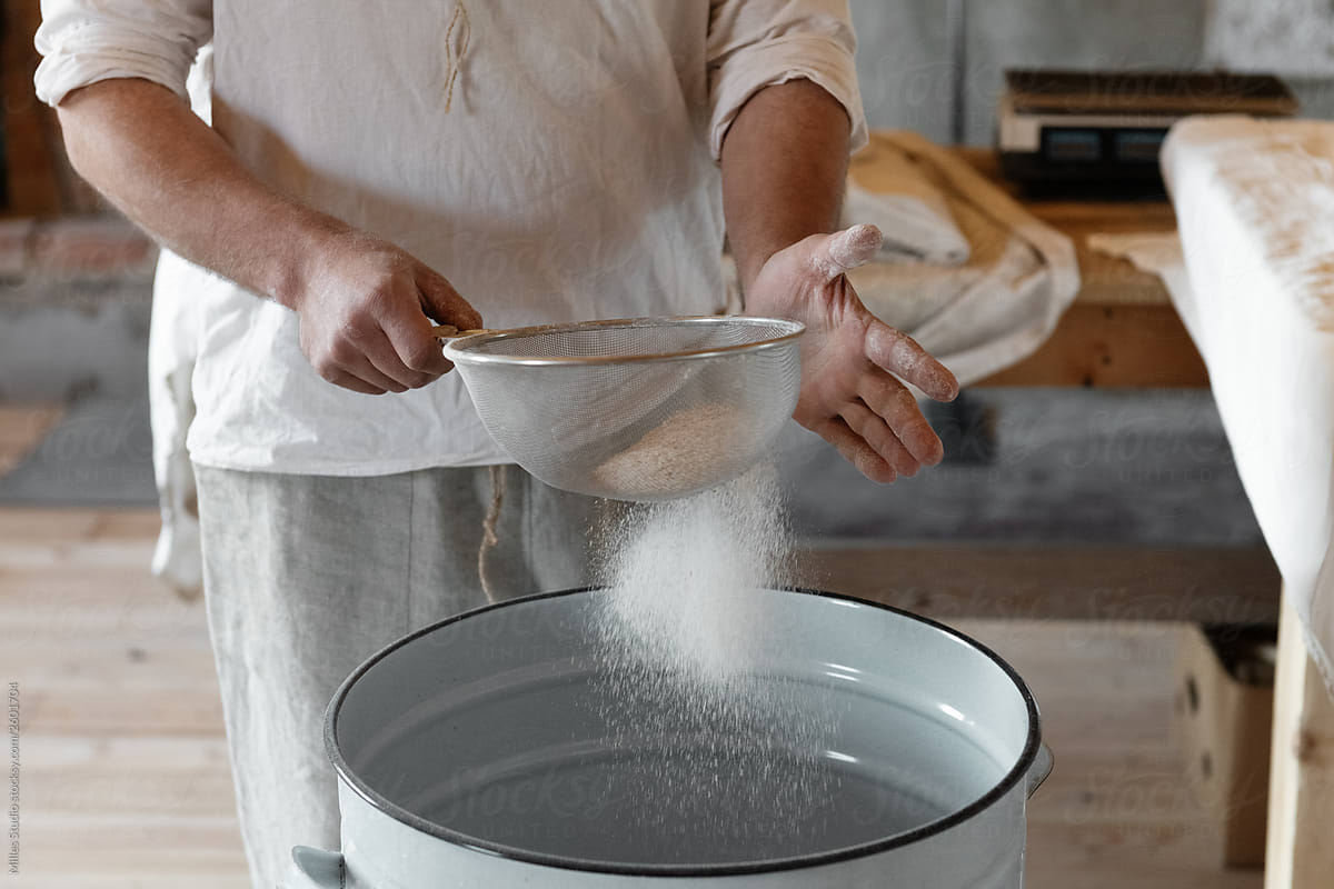 Crop baker sifting flour