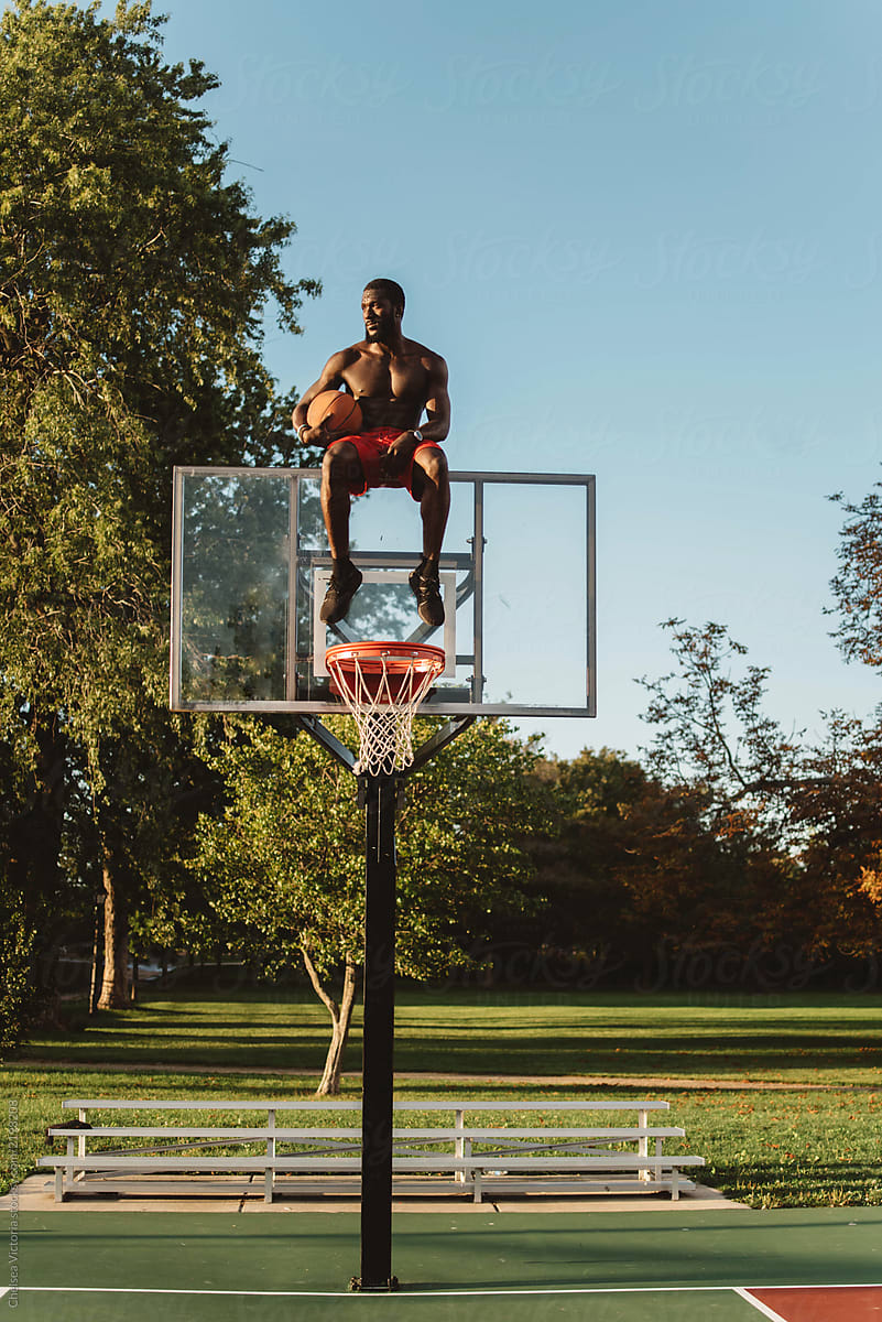 An Attractive Young Black Man Playing Basketball O On A Sunny Day By Stocksy Contributor 