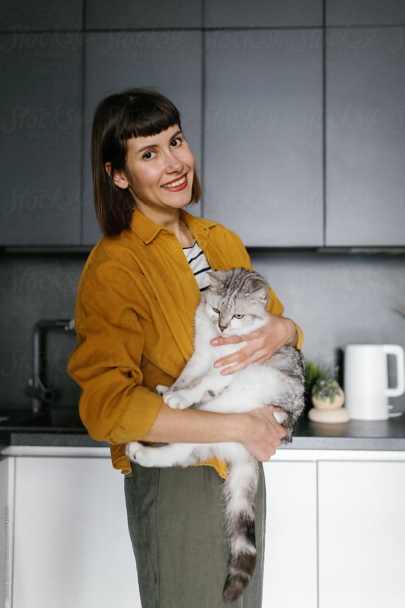 Pet couple time. Stylish kitchen. Animal owner. Love happiness