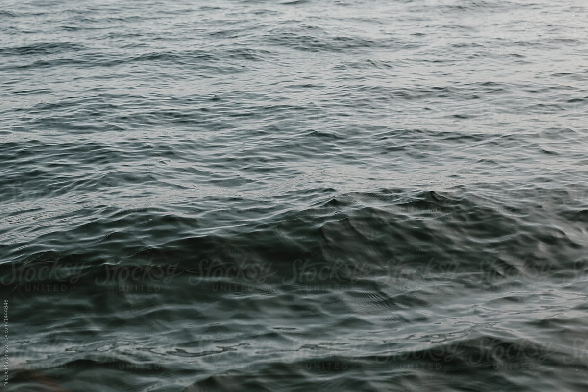 detail of ripples and texture of dark ocean water