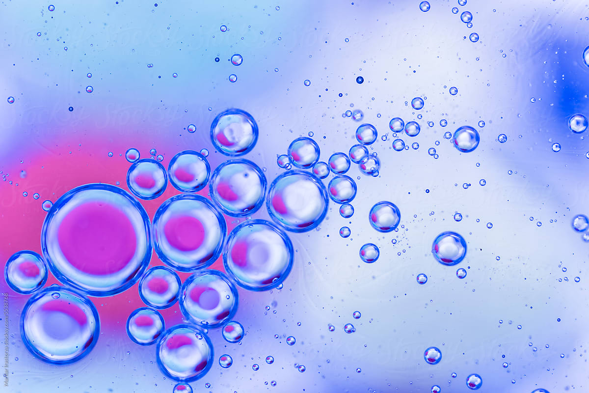 Blue And Pink Oil Drops On Water Surface