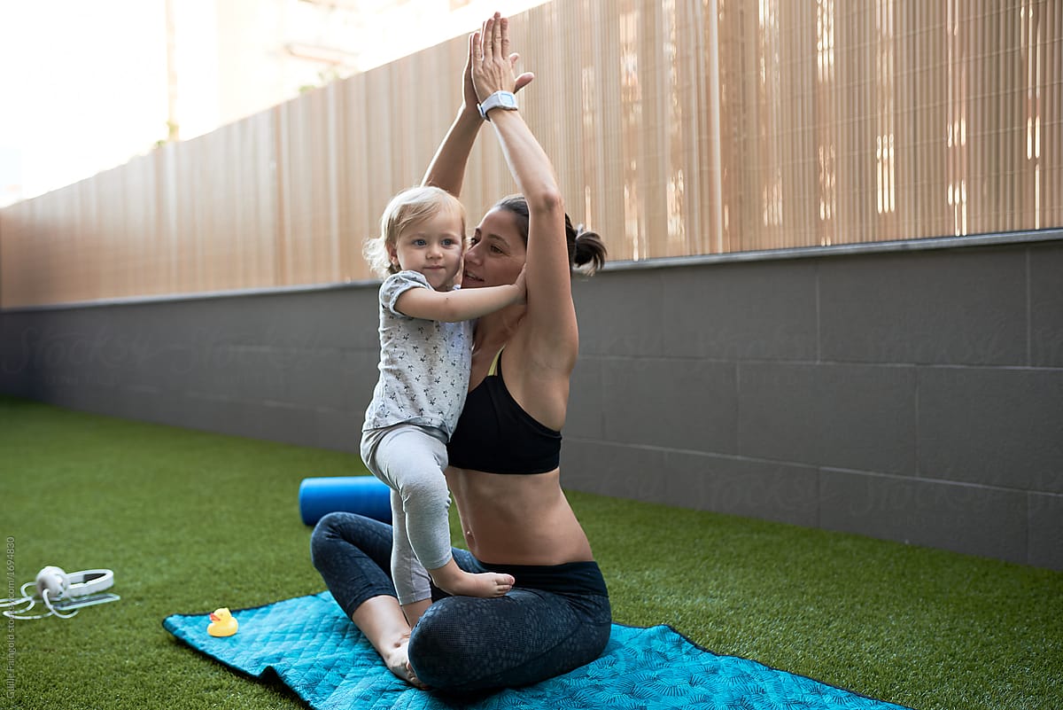 Mother And Baby During Yoga Practice By Stocksy Contributor Guille Faingold Stocksy