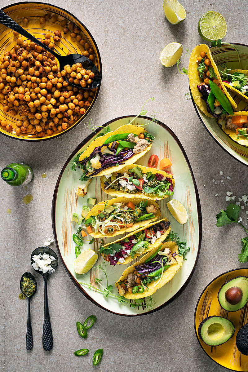 Overhead healthy vegetarian tacos on a plate with ingredients