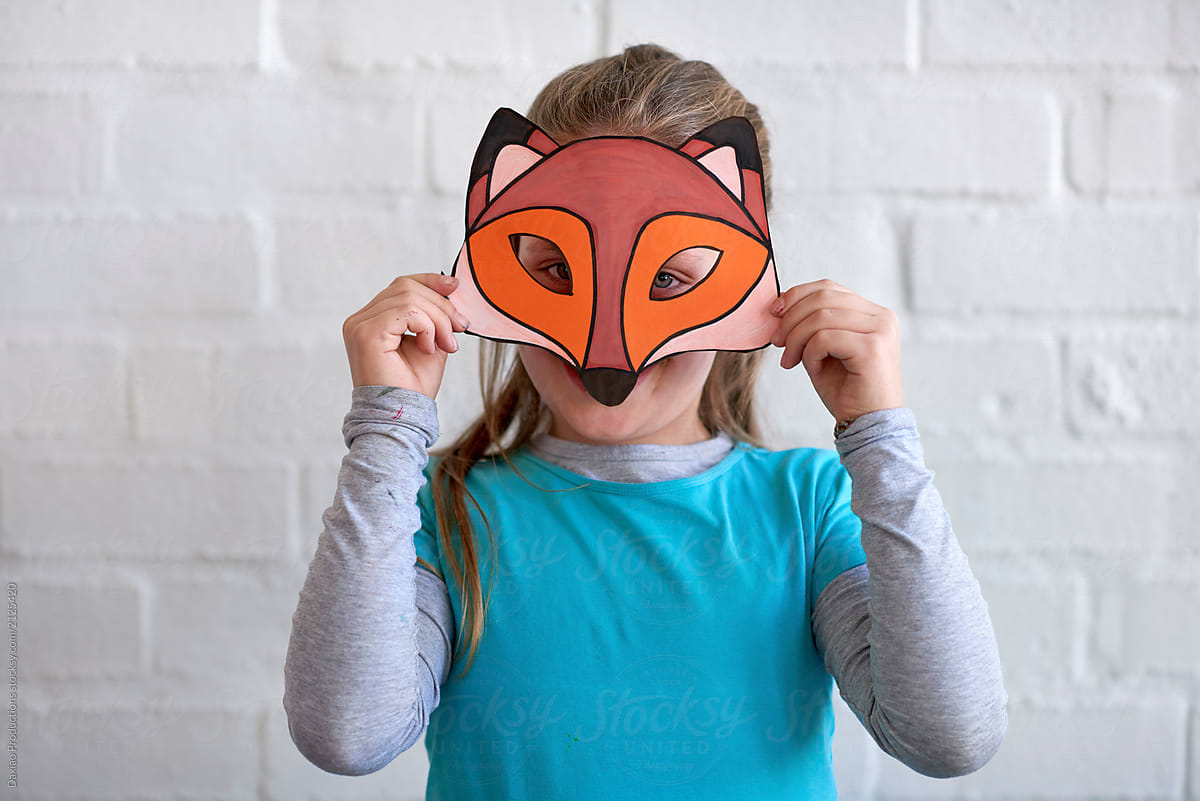 Cute kid with fox face mask