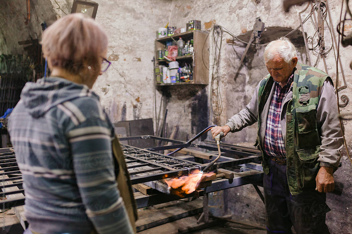 Father And Daughter, Co-Workers in Blacksmith Workshop