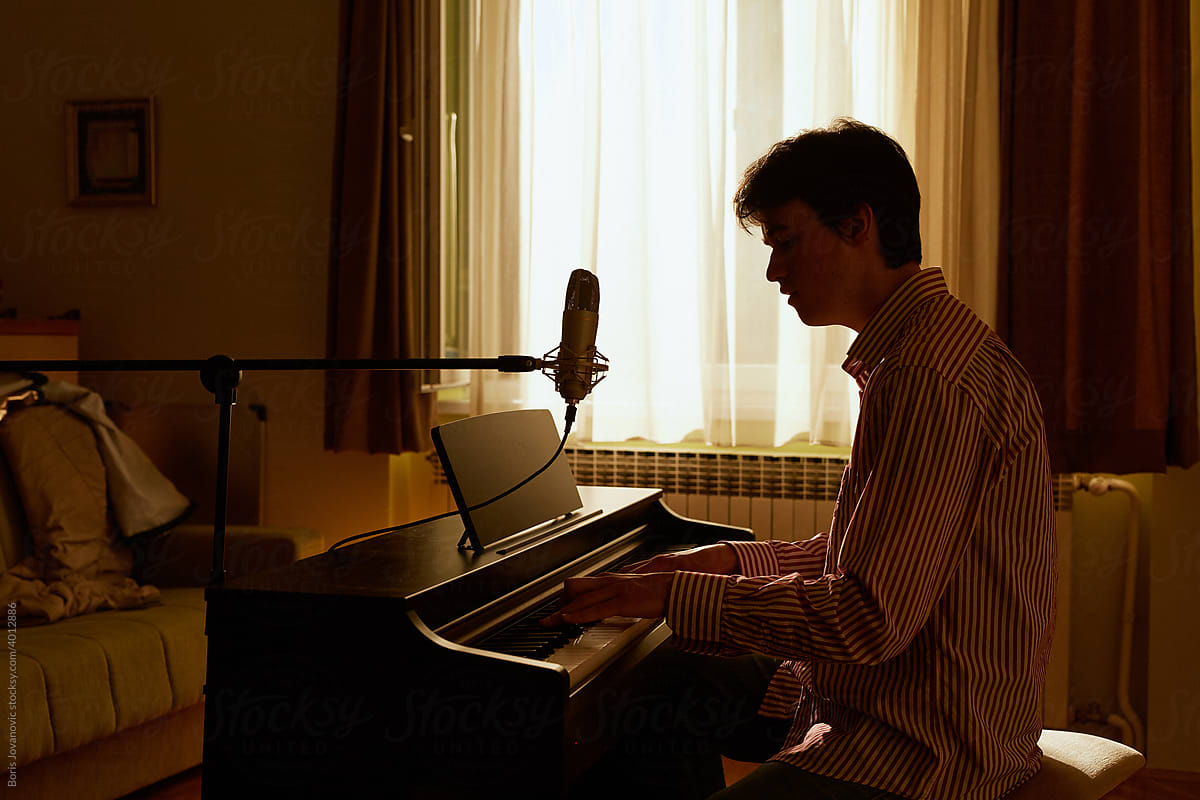 Young Man Making Music On The Piano