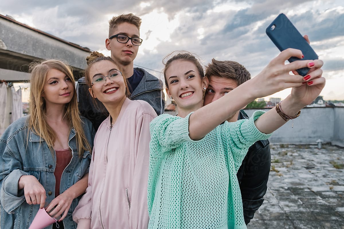 Group Of A Teenage Friends Having Fun And Taking Group Selfie On The 